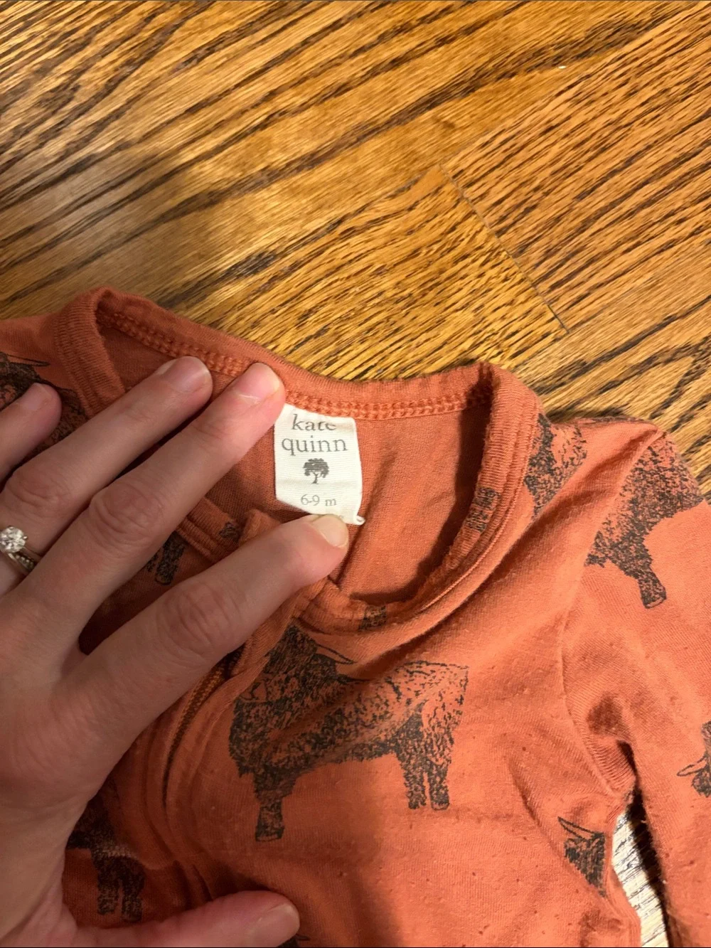 kate quinn Rust Orange Footed One-Piece with Black Highland Cow Print
